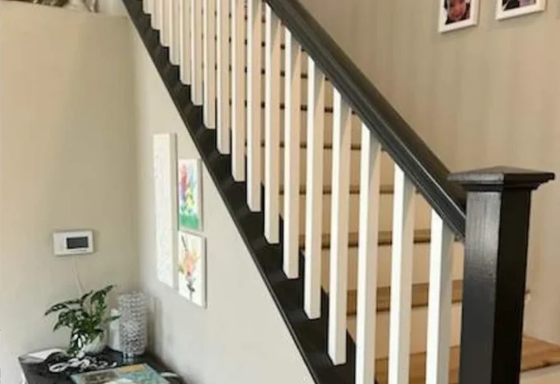 Stair railing refinished in black and white